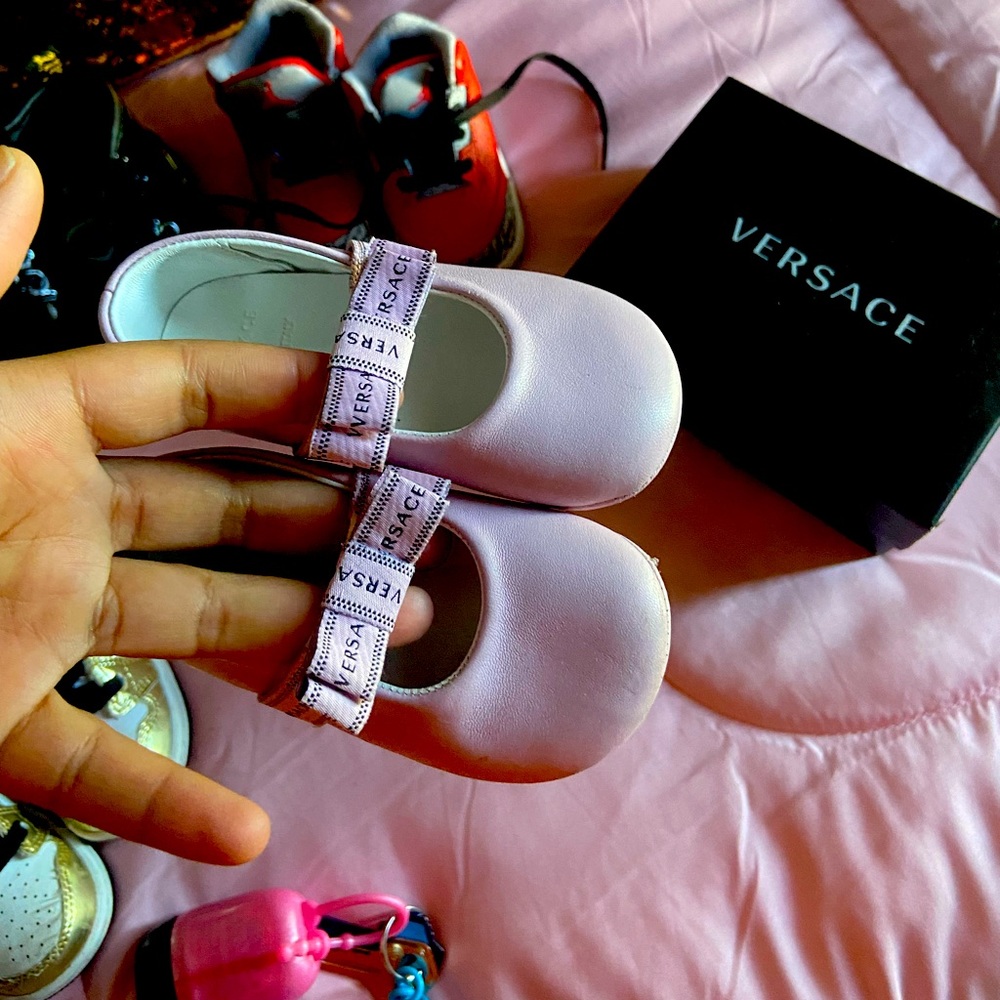 pink baby girl Versace shoes, they are worn once for a non walking baby.